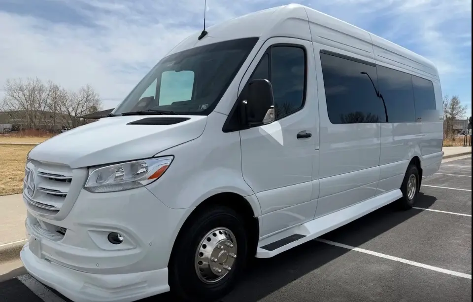 Manitou Springs 16 passenger white Sprinter limo bus